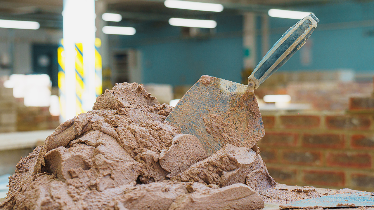 Trowel in a pile of Masonry Cement