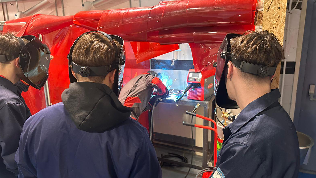 Fronius pulse welding equipment being demonstrated to apprentices