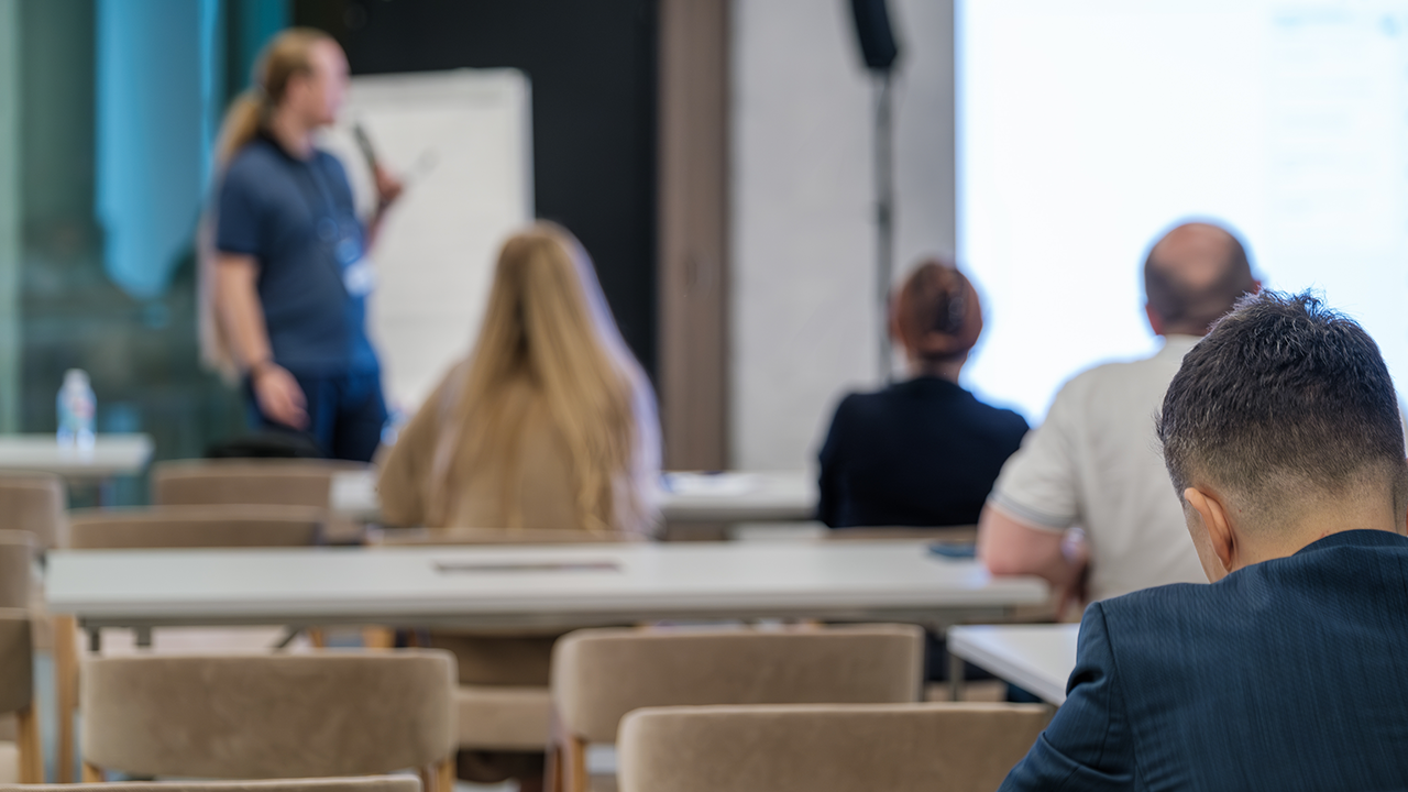 Wide image of a meeting room presentation