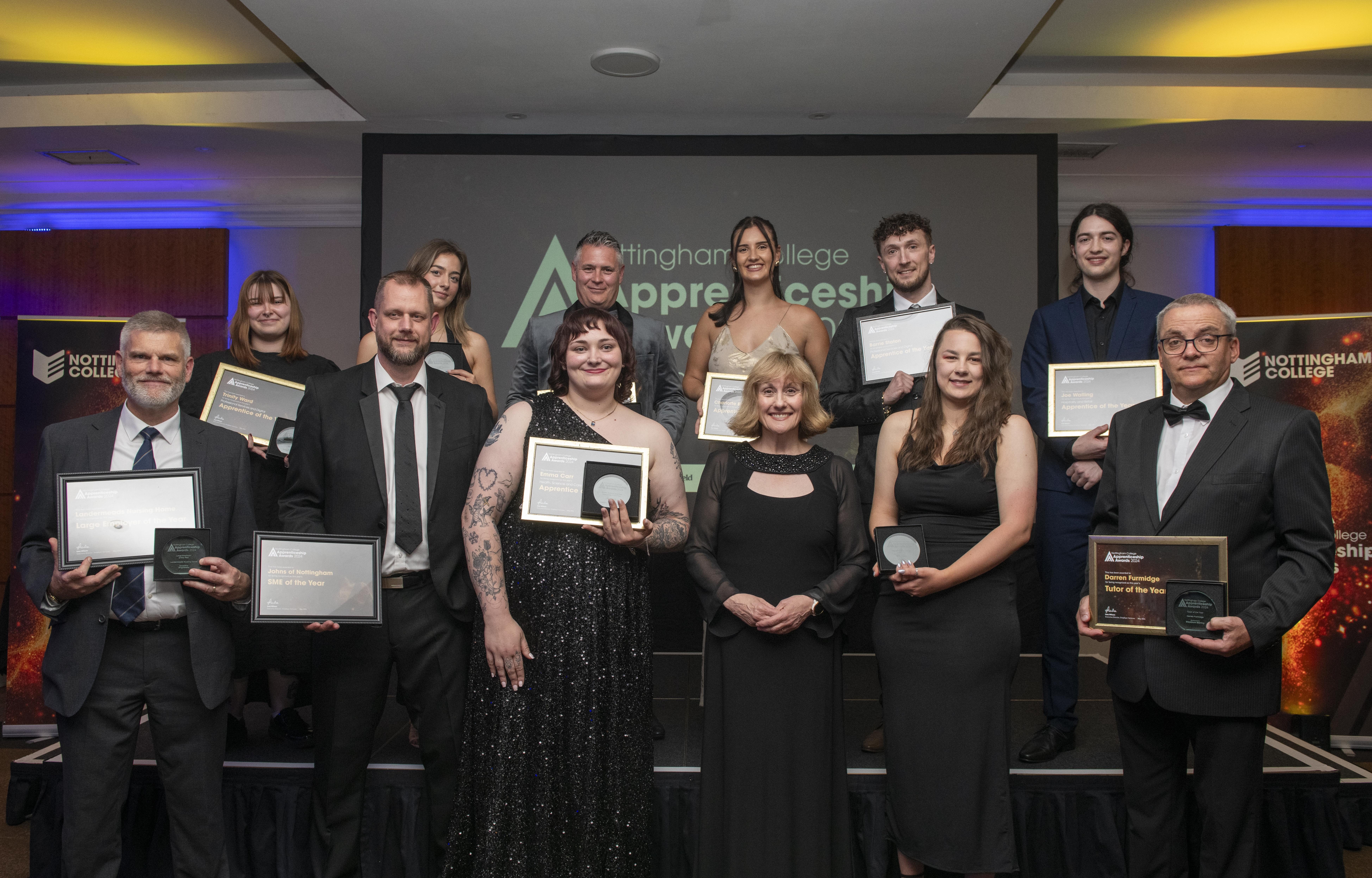 Award winners holding their certificates at the Nottingham College Apprenticeships Awards