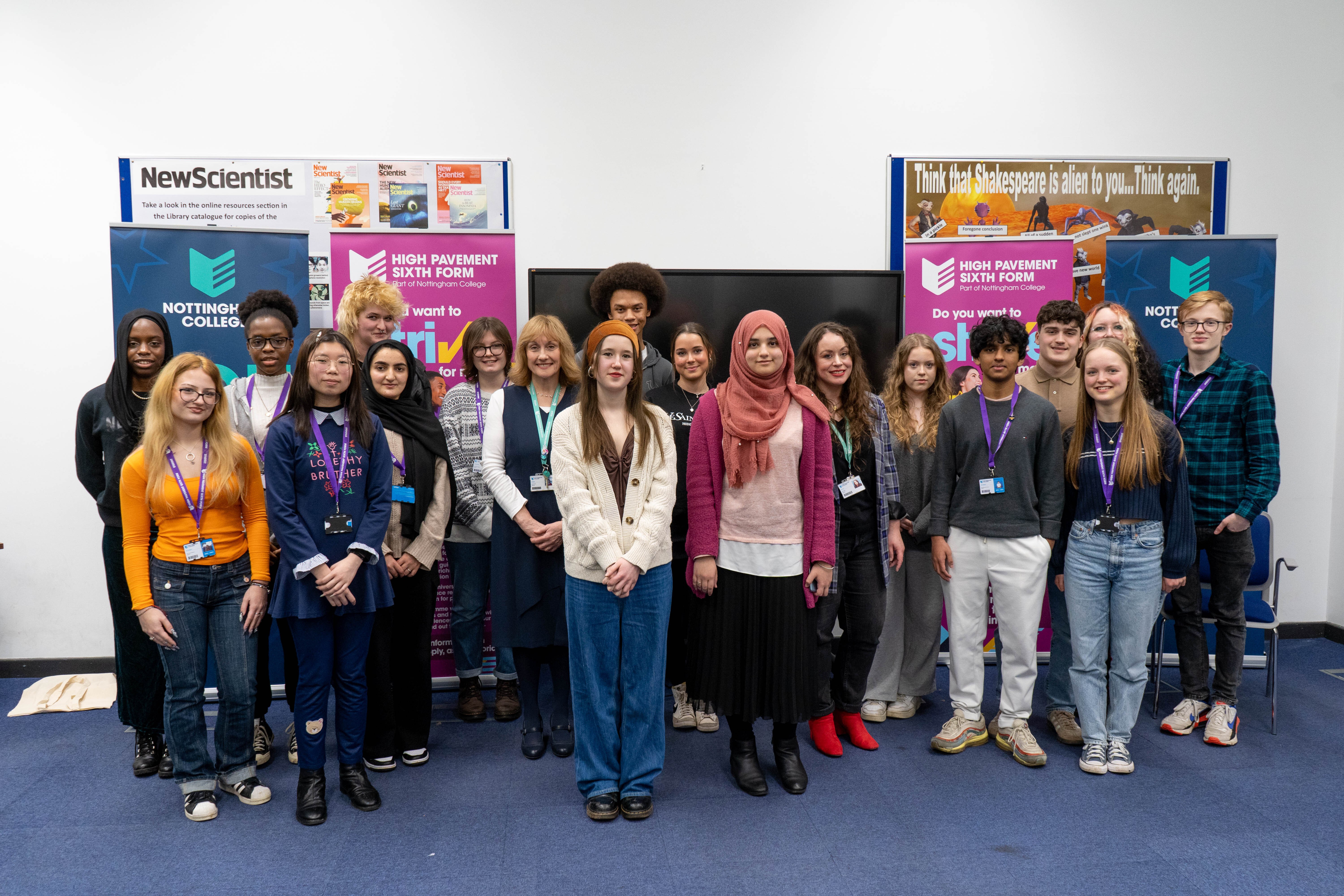 Students standing in front of banners at the High Pavement Sixth Form centre.