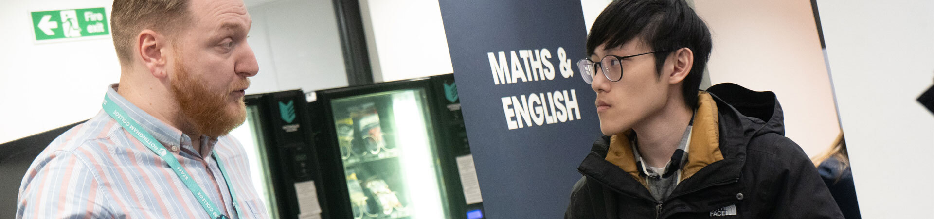 A student talking to a staff member about course guidance