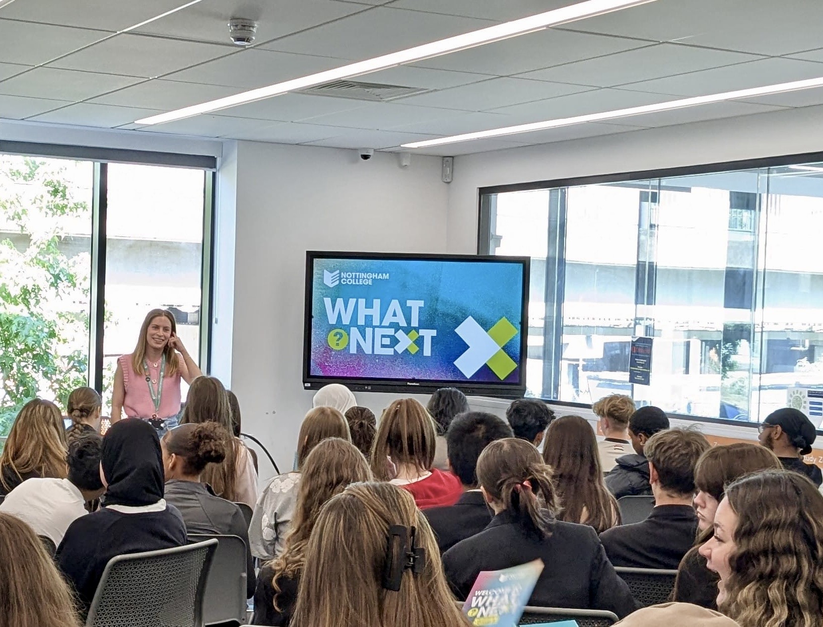 a member of staff running a college event