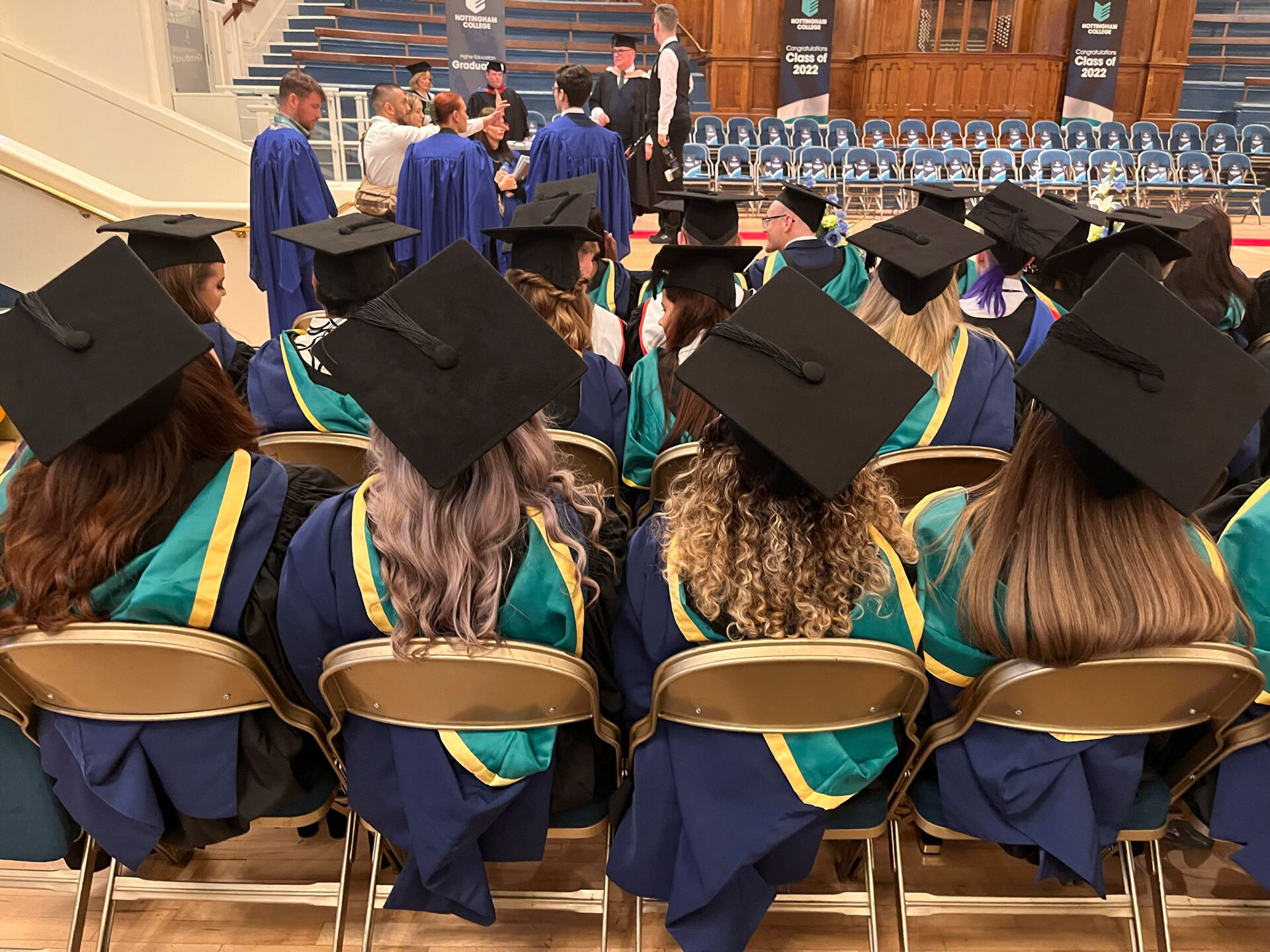A picture of some graduates at a graduation ceremony in their gowns