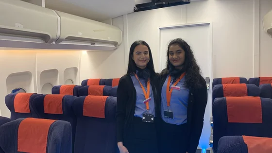 Students in the airline cabin in the City Hub