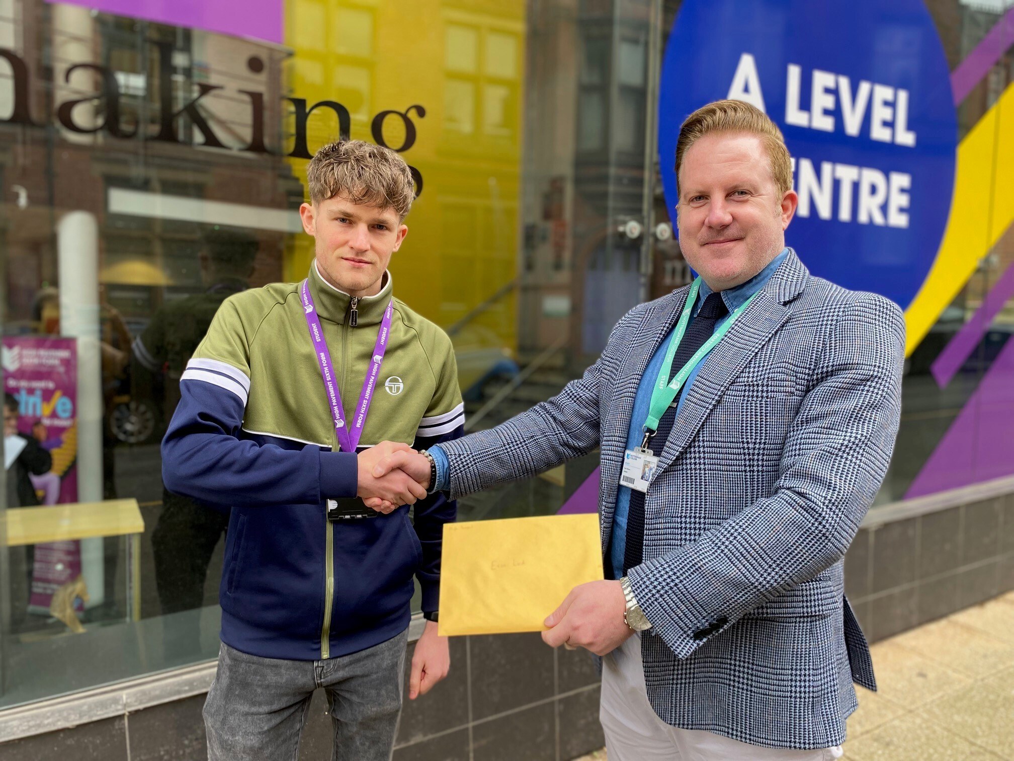 Evan with a member of staff outside the High Pavement Sixth Form Centre