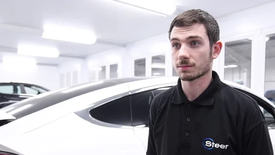 A Steer Automotive apprenticeship being interviewed inside a workshop