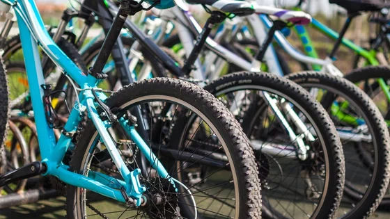 A row of bikes in a bike stand