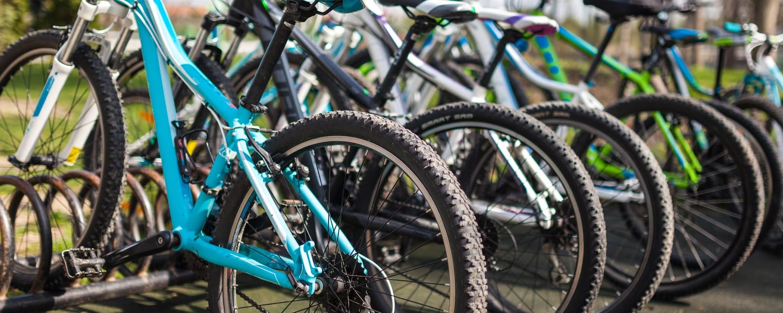 A row of bikes in a bike stand