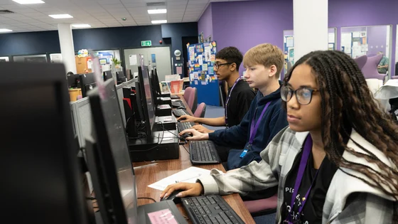 Students using computer workstations in the library