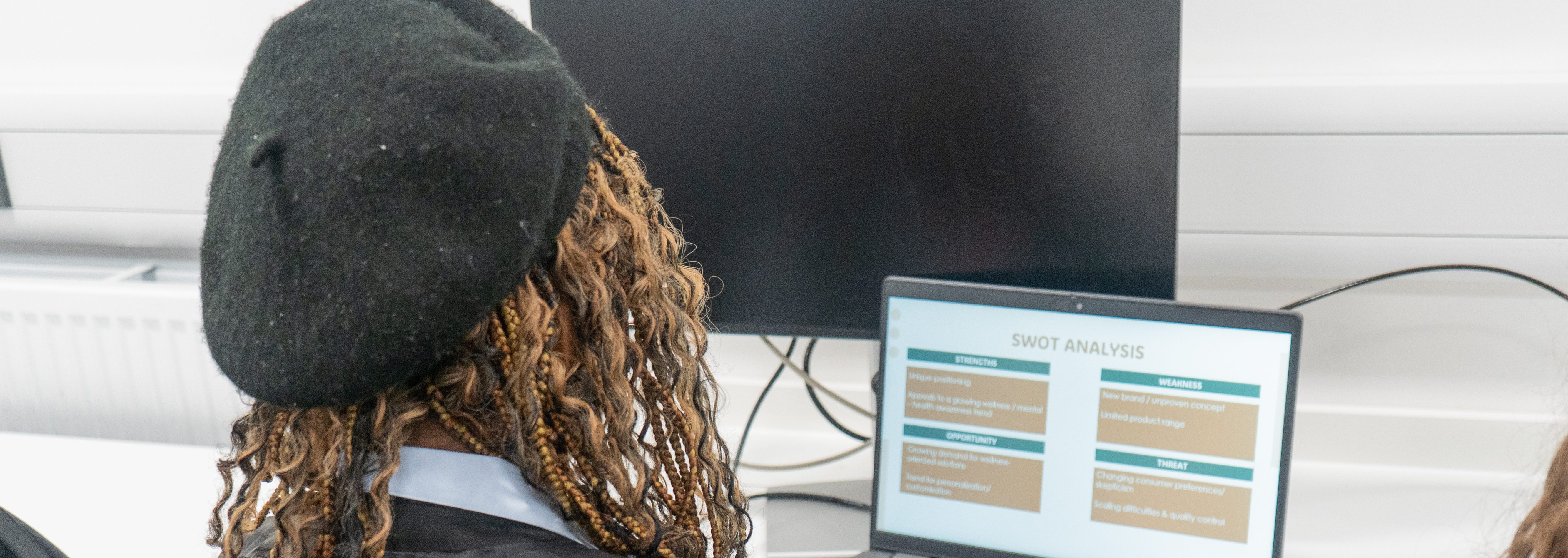 Business student working on their laptop