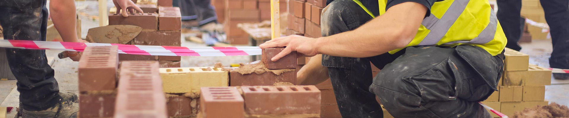 Students laying bricks