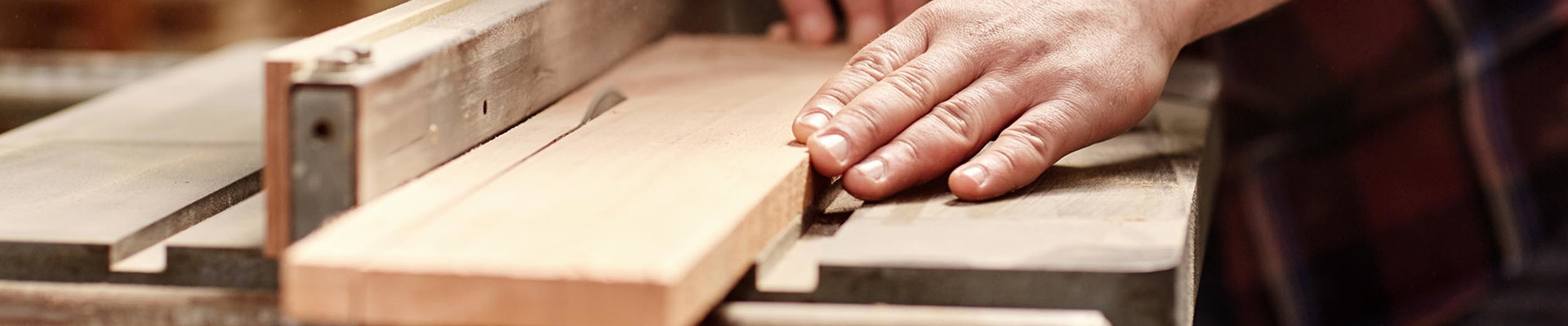 A student cutting wood