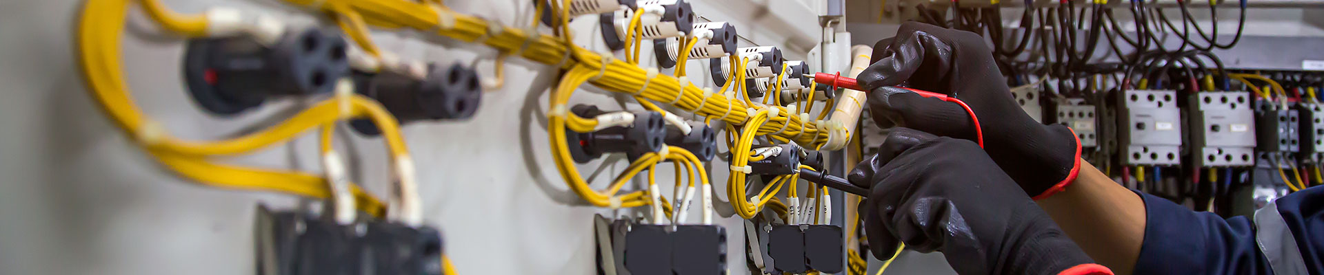 An electrical installation student working on a wiring loop.