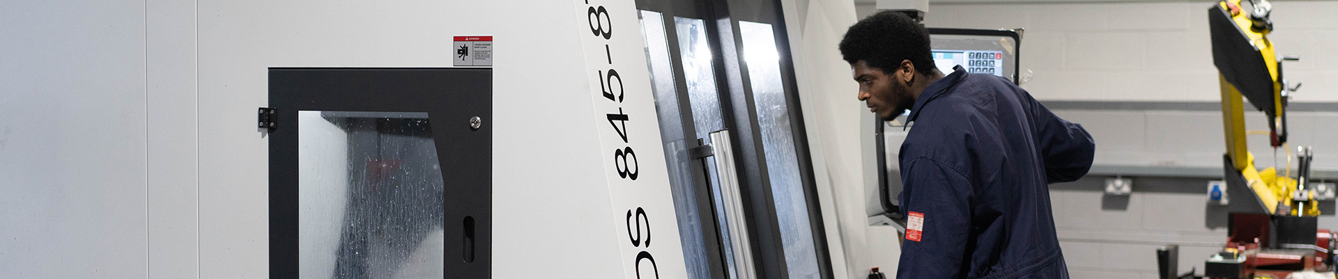 A student working on engineering machinery