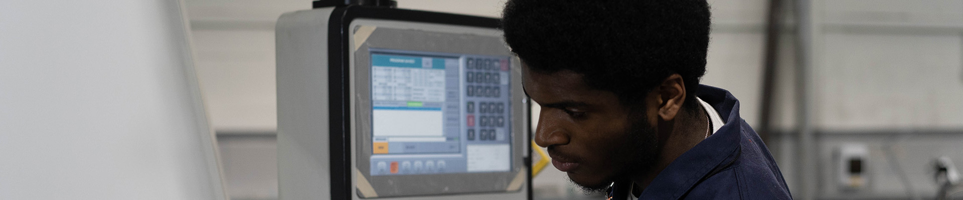 A student working on an engineering machine