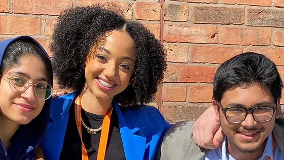 A group of young students smiling