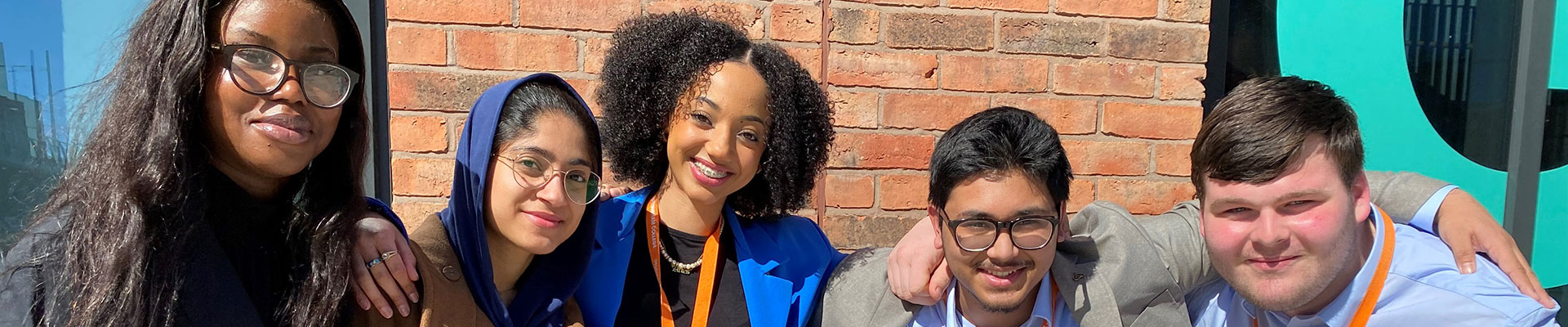 A group of young students smiling