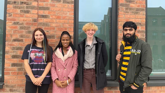A group of students standing outside the City Hub.
