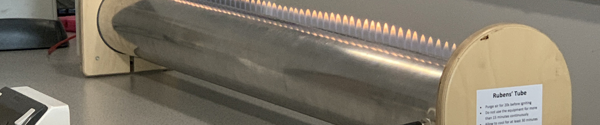A Rubens machine with flames coming out of the top.