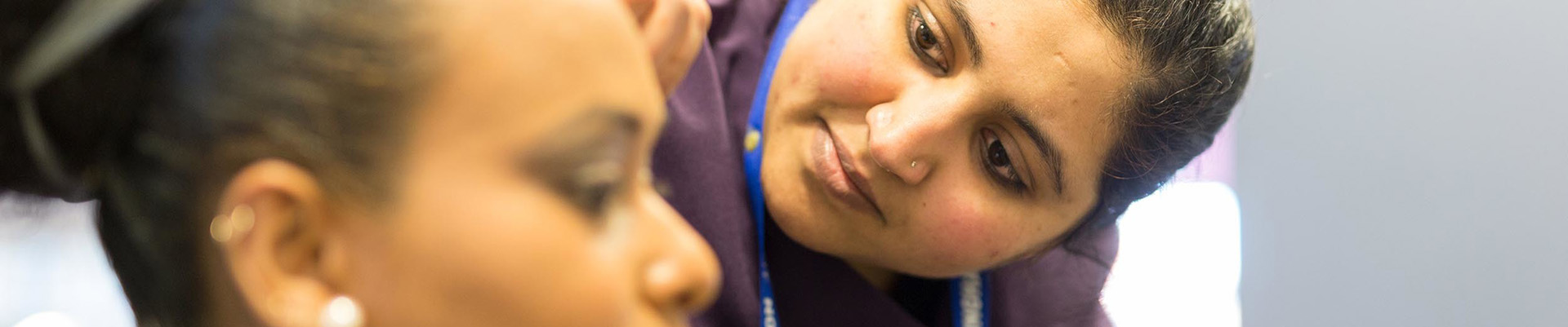 A student doing a client's hair