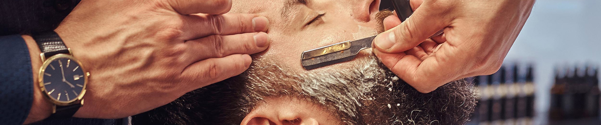 A client having a beard trim