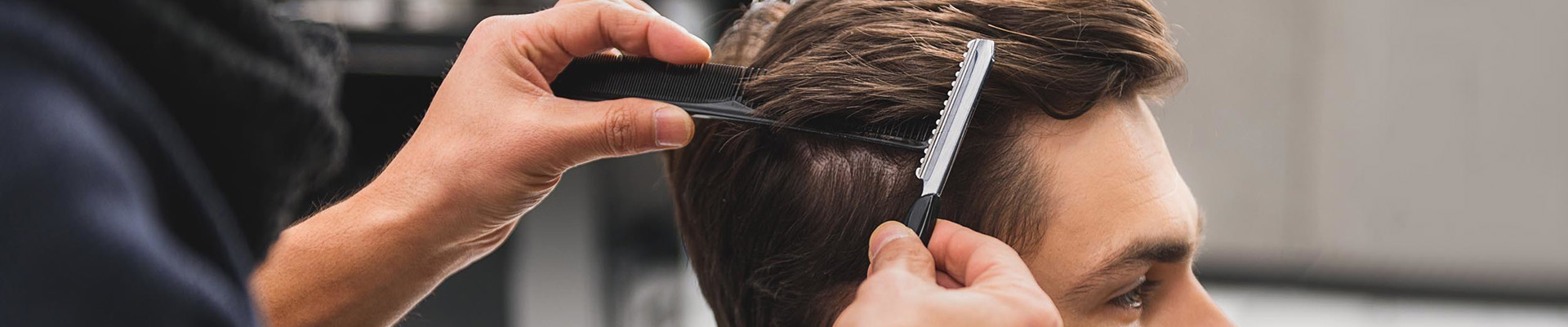 A client having his hair cut