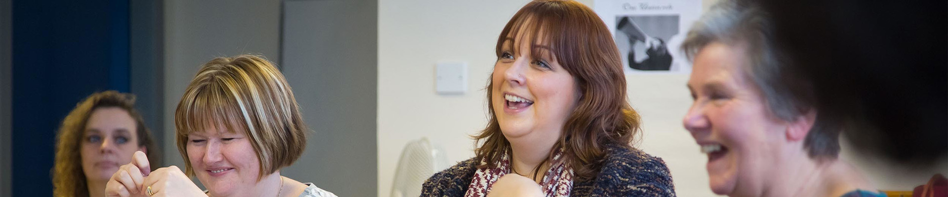 A group of students smiling and talking.