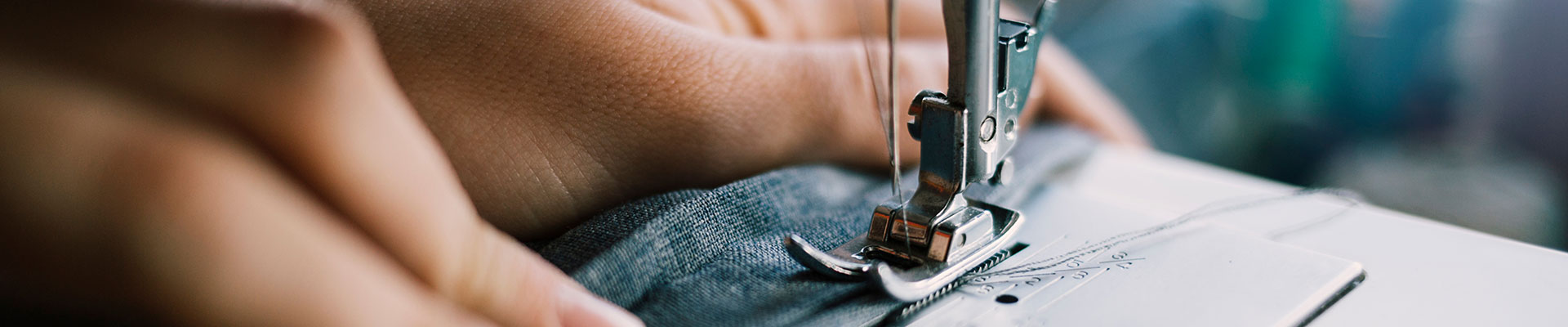 A person using a sewing machine