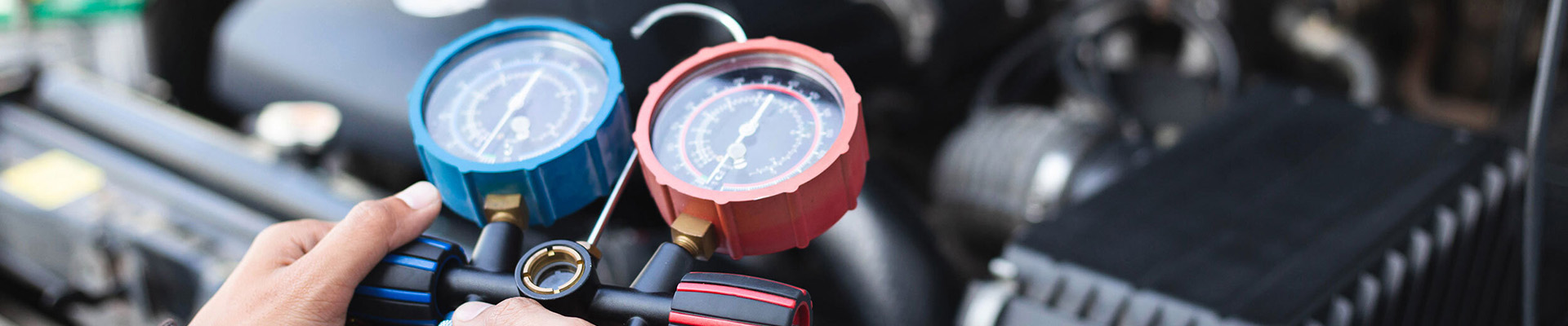 A mechanic working on a car