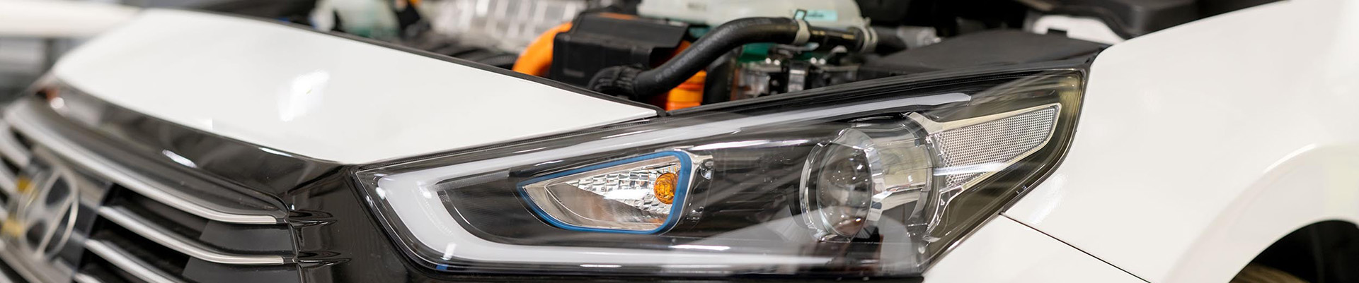 A Hyundai car with it's bonnet up