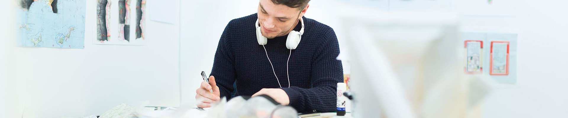 A fine art student drawing in an art studio at the Adams Building.
