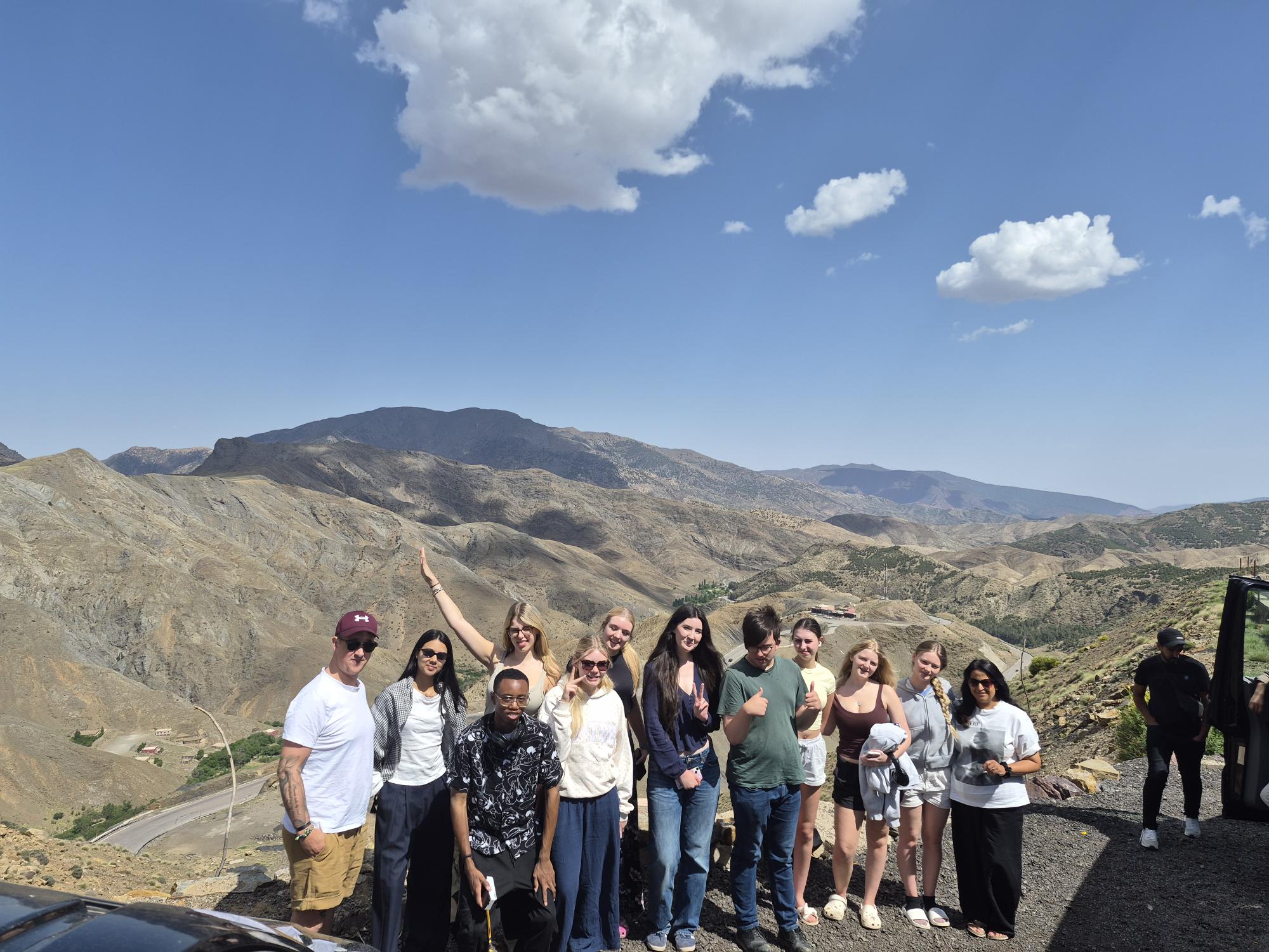 Nottingham College students posing in front of mountains