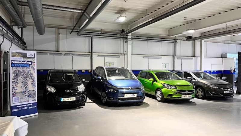 Cars parked in an automotive workshop at Emtec in Ruddington.