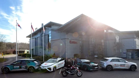 Electric and hydrogen cars and an electric bike outside the Emtec building