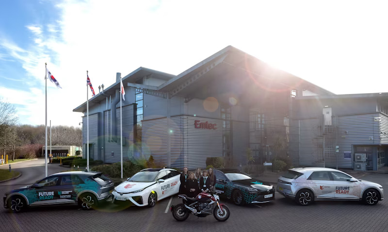 Electric and hydrogen cars and an electric bike outside the Emtec building