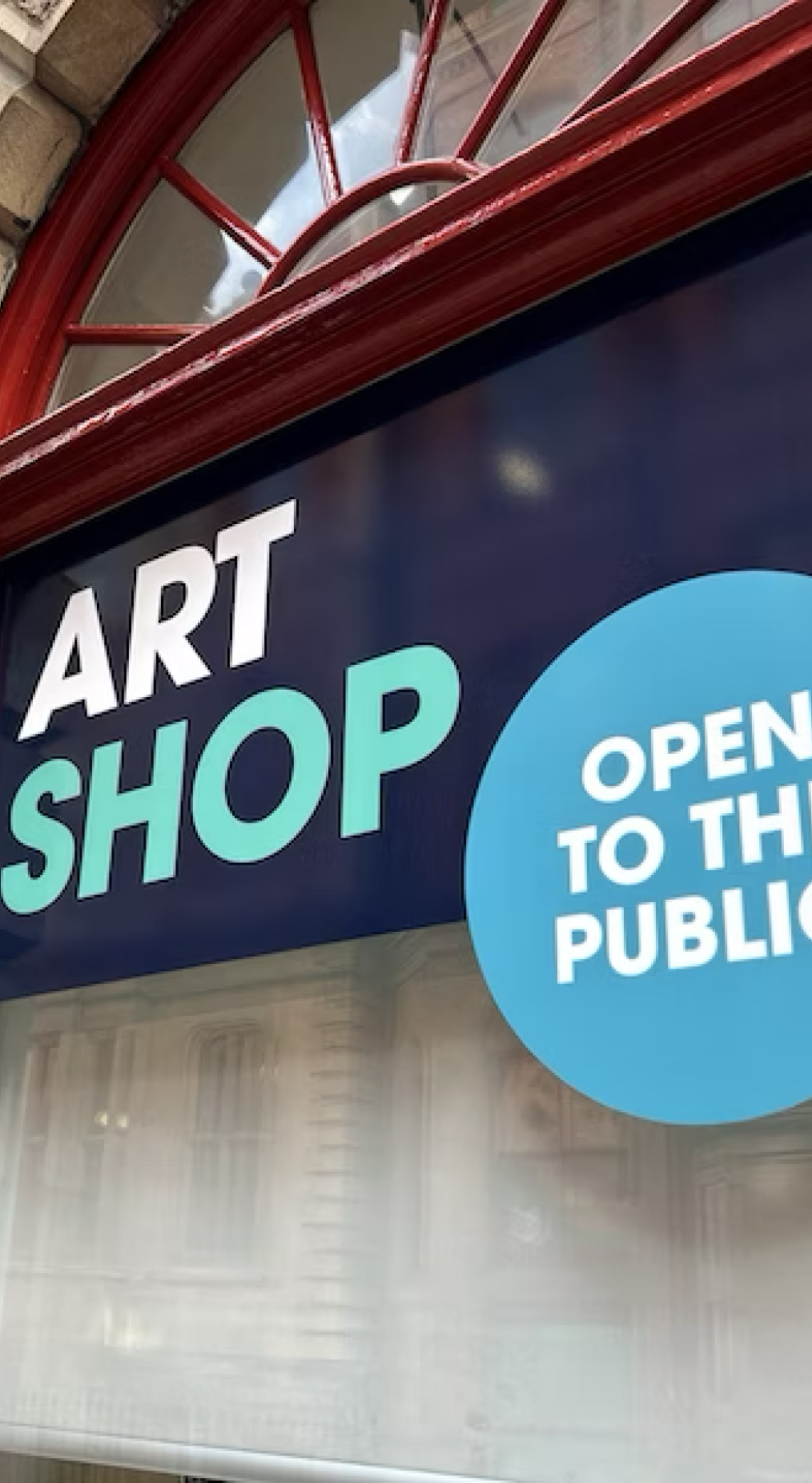 Exterior signage of the Art shop showing open to the public