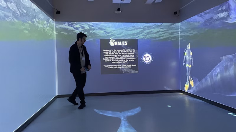 A student in the immersive room at the Basford campus.
