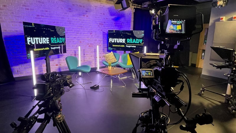A recording studio with cameras and lighting rigs set up