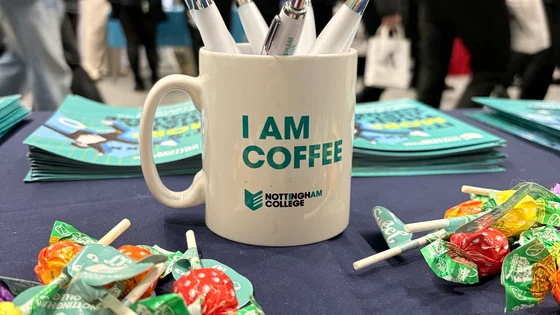 Nottingham College merchandise on a table at a careers fair.