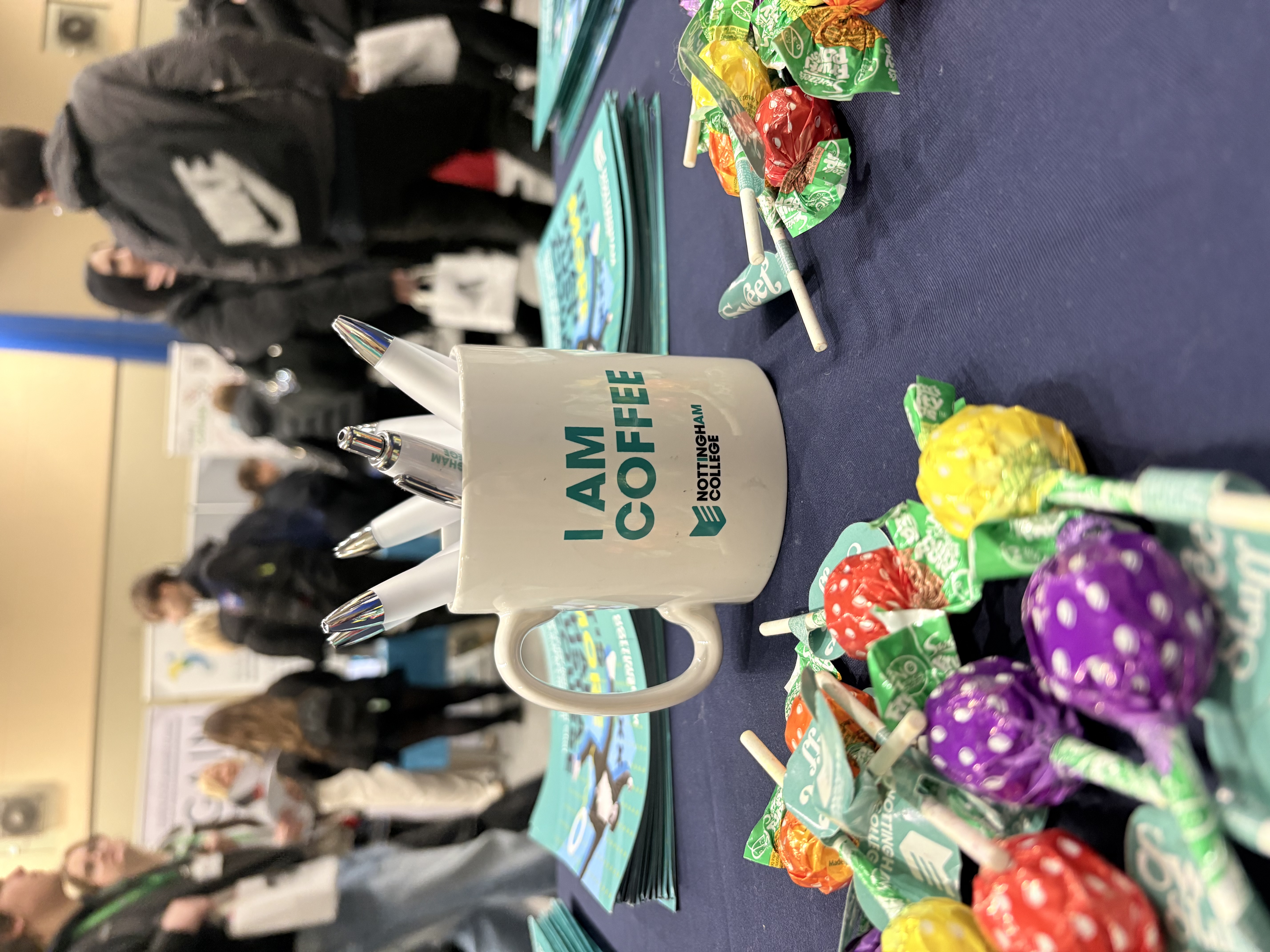 Nottingham College merchandise on a table at a careers fair.