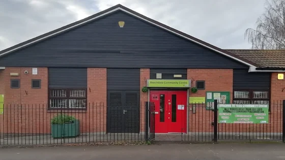 Beechdale Community Centre front entrance with a double red door