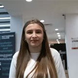 A student smiling in the City Hub campus