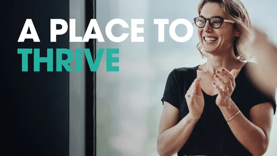 Text that says "a place to thrive" and a woman with glasses on.