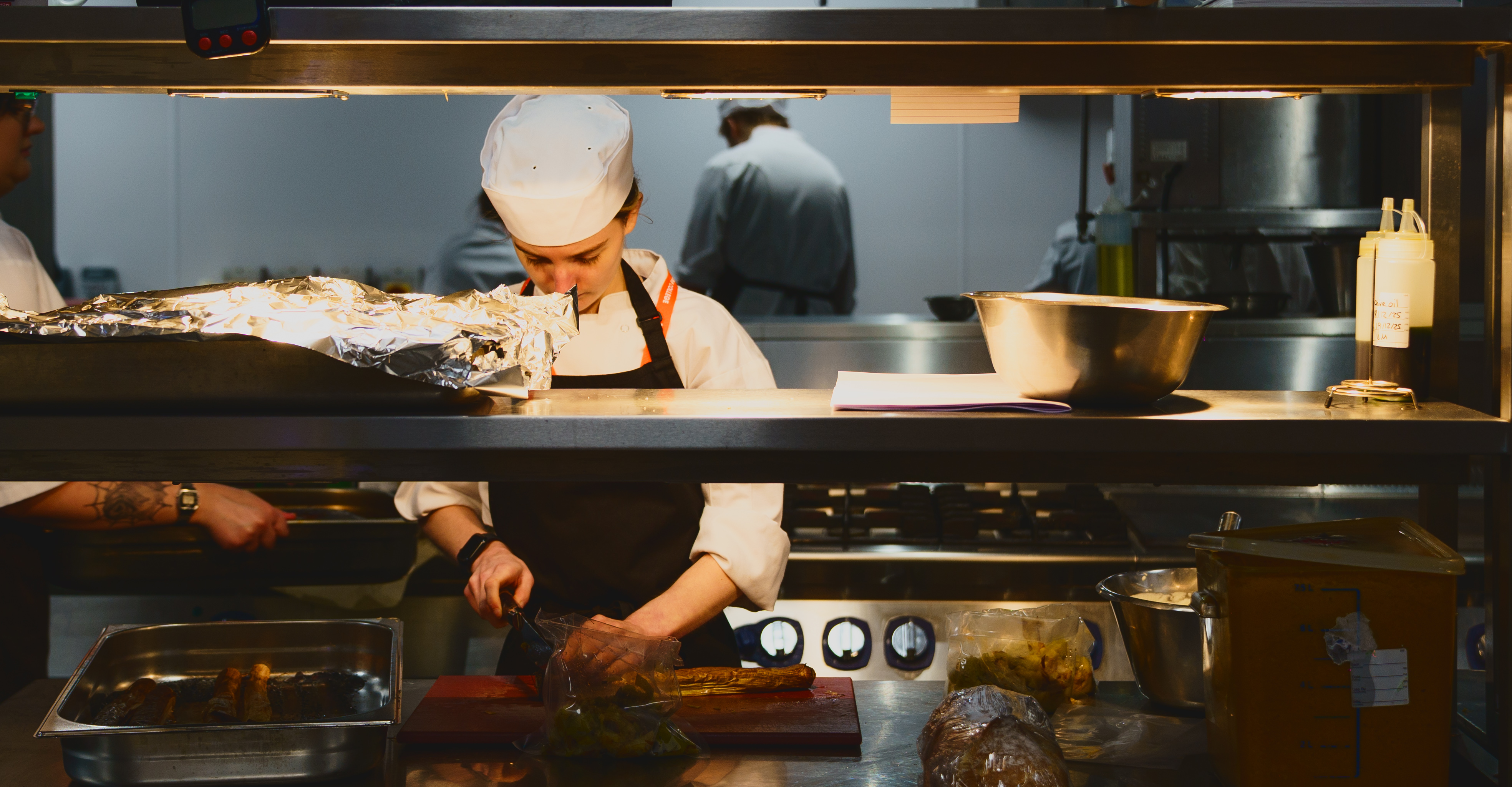 Student chef preparing some food in the kitchen