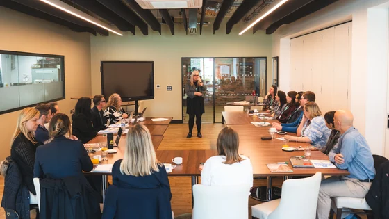 A group of industry professionals meeting to discuss how the teaching programme can improve