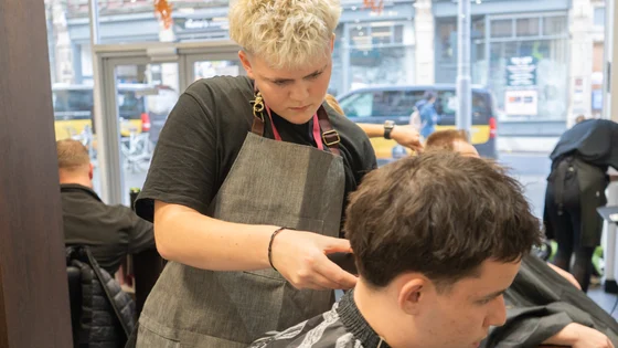 Hairdressing student cutting a clients hair
