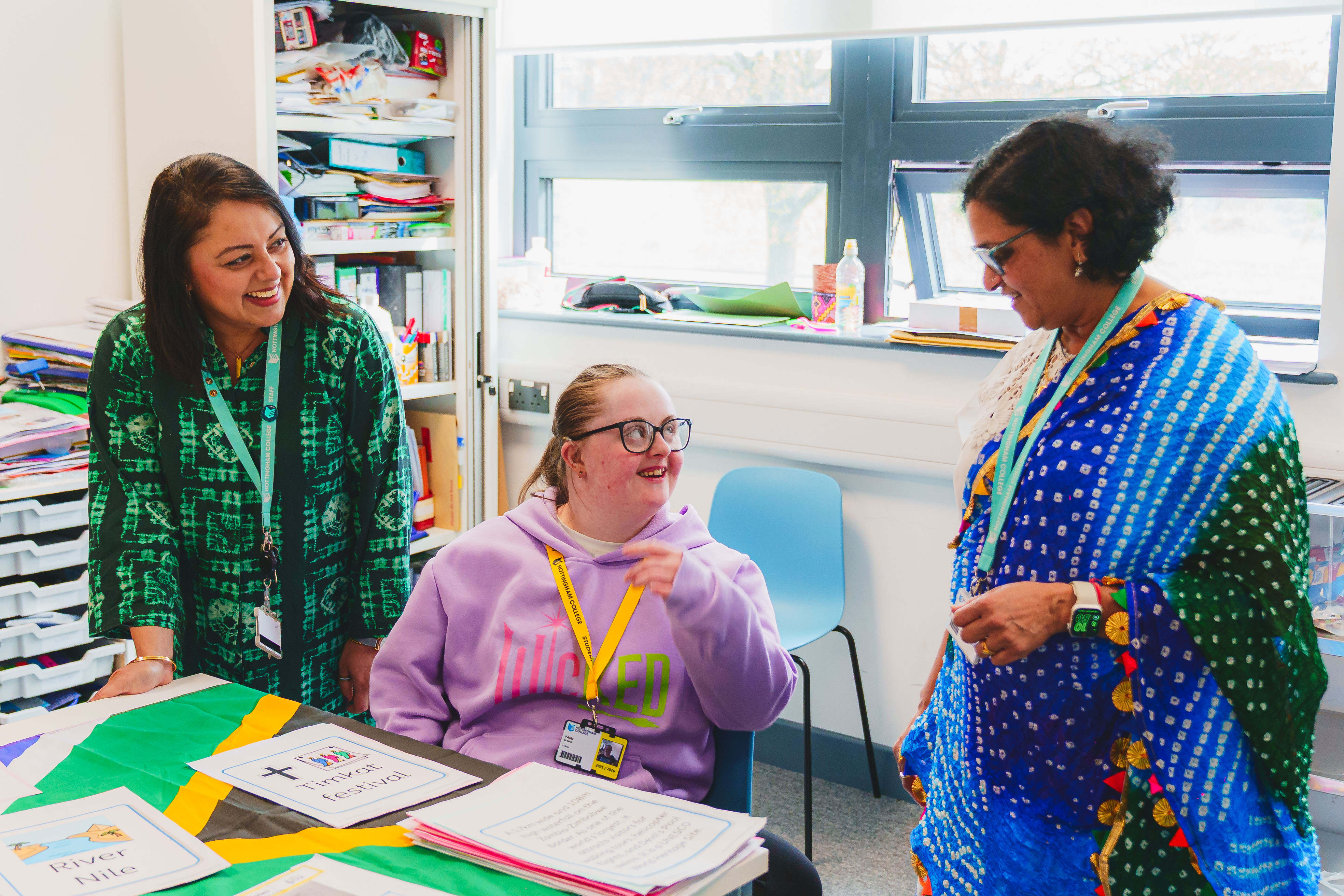 Basford - The Gateway staff showing students a cultural dress/outfit