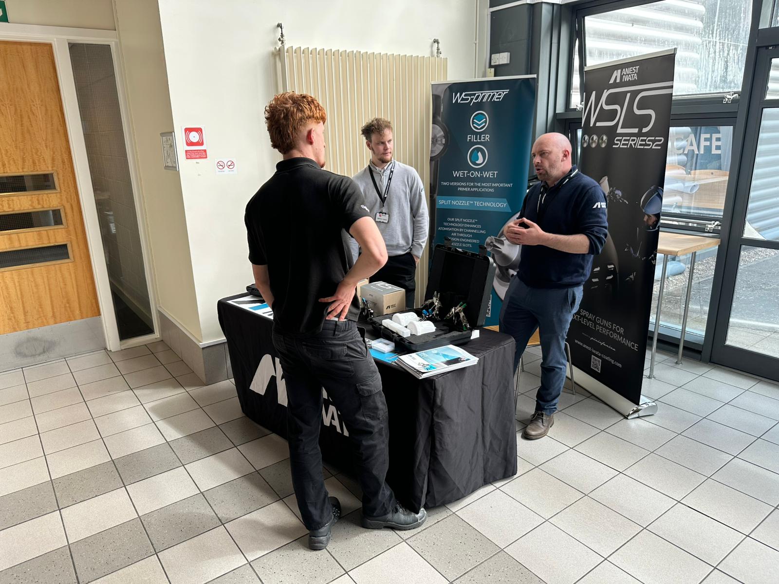 Student engaging with Anest Iwata stand