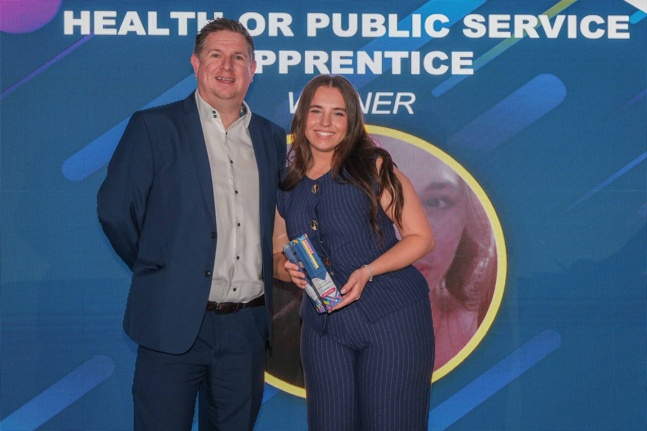 Student poses with her award